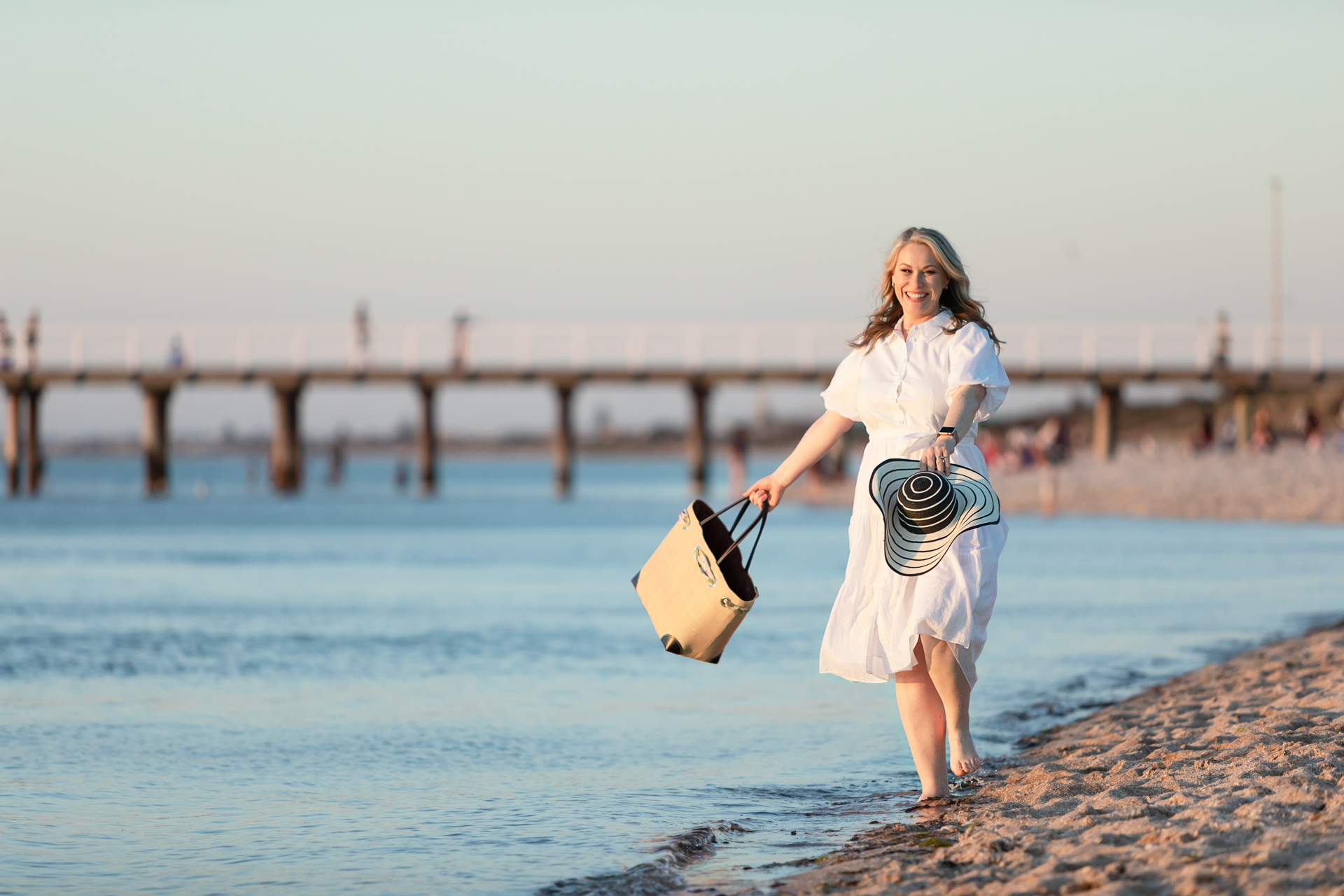 personal branding photo of a female business owner walking along the beach