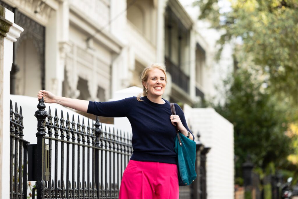 Lady leaning on a fence