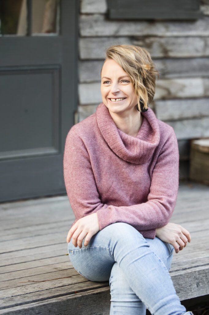 Portrait of a lady sitting on a deck