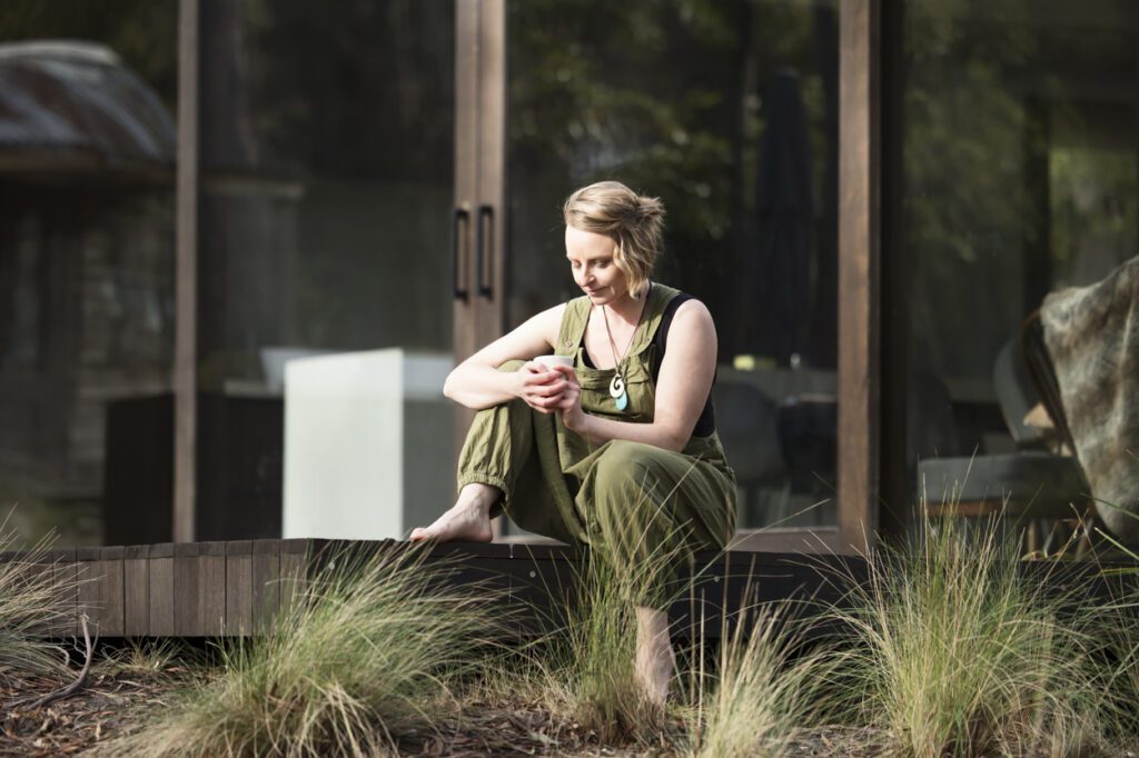 Image of a lady sitting on a verandah